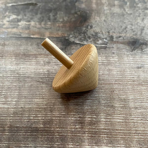 Small wooden spinning top