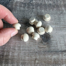 Load image into Gallery viewer, Hand holding a tiny wooden mushroom