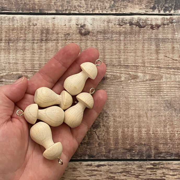 40mm mushroom decorations in open hand