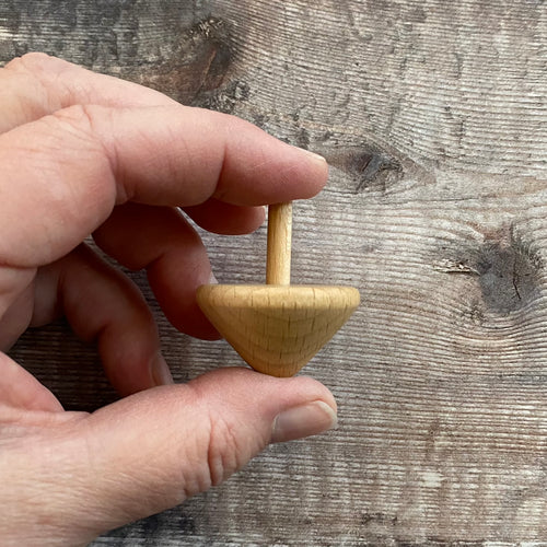 Cone shape spinning top