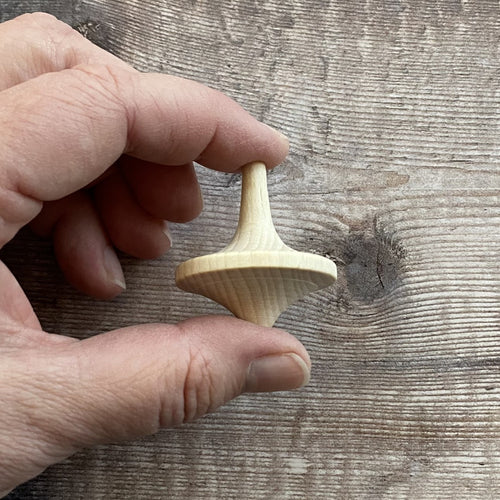 Spaceship spinning top